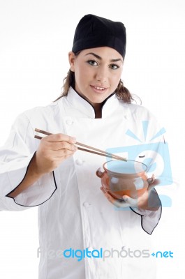 Lady Chef Holding Chopstick And Pot Stock Photo