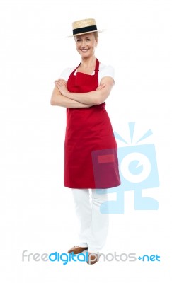 Lady Chef Standing With Arms Folded Stock Photo