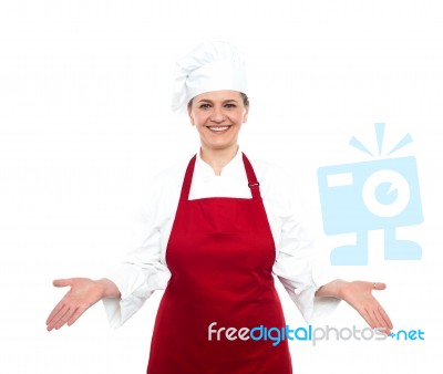 Lady Chef Standing With Open Palms Stock Photo