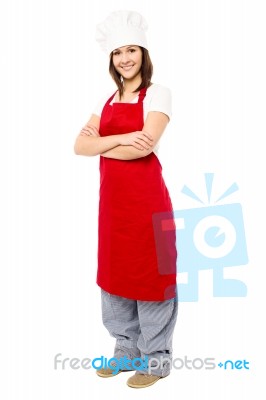 Lady Chef Wearing Apron, Full Length Shot Stock Photo