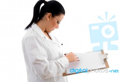 Lady Doctor Checking Prescription Stock Photo