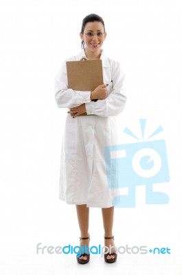 Lady Doctor standing With clipboard Stock Photo