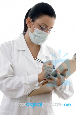 lady Doctor writing Prescription Stock Photo