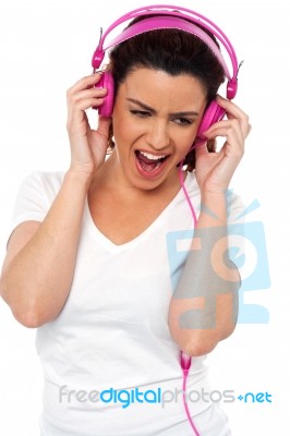 Lady Enjoying Music Stock Photo