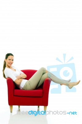 Lady Is Sitting On The Chair Stock Photo