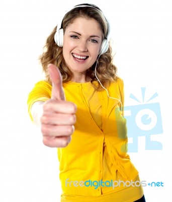 Lady Listening Music With Thumbs Up Stock Photo