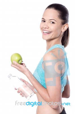 Lady Looking At Camera With Green Apple Stock Photo