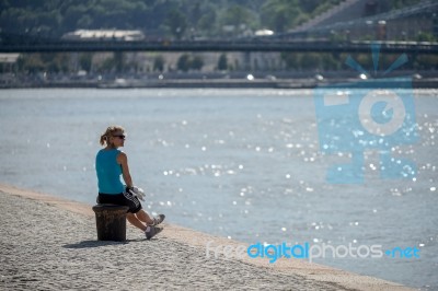 Lady Looking At The River Danube In Budapest Stock Photo