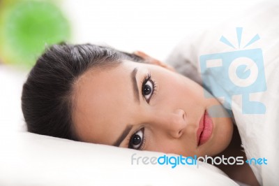 Lady Lying In Bed Stock Photo