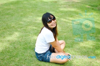 Lady On The Grass Field Stock Photo