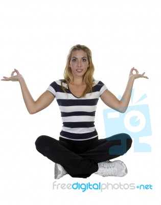 Lady Performing Yoga Sitting In Lotus Pose Stock Photo