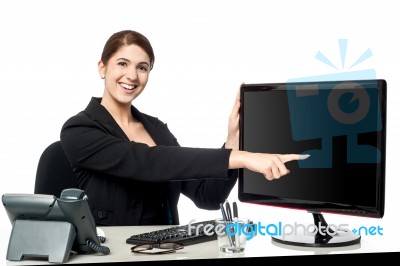 Lady Pointing Something On Computer Screen Stock Photo