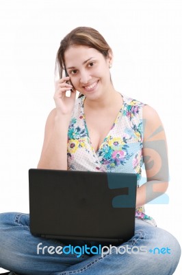 Lady Talking Over Phone With Laptop Stock Photo