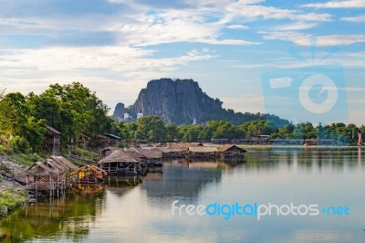 Lake In Lopburi, Thailand With A Holy Mountain In The Background… Stock Photo