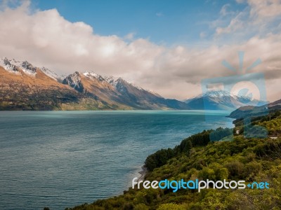 Lake With Snow Caped Mountains Stock Photo