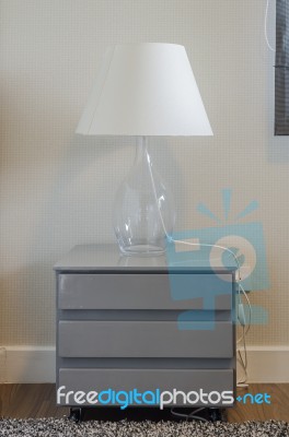 Lamp On Grey Table In Bedroom Stock Photo