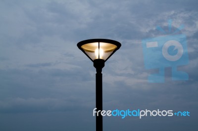 Lamp Post With Stormy Sky Stock Photo