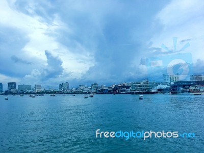 Landscape Of Sea With Boat And Downtown And Building And Blue Sky Stock Photo