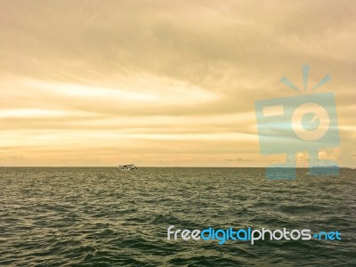 Landscape Of Sea With Boat And Fishing Men And Blue Sky Stock Photo