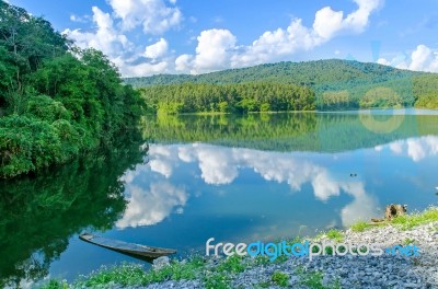 Landscape Of The Dam And Lake On The Mountain With Tree And Forest And The Boat Stock Photo