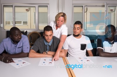 Language Training For Refugees In A German Camp Stock Photo