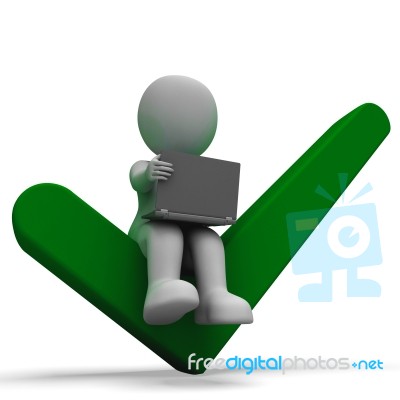 Laptop And Tick Showing Online Success Stock Image