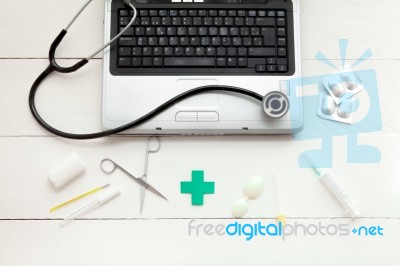 Laptop Computer And Retro Medical Instruments Stock Photo