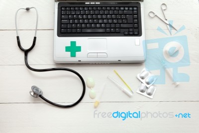 Laptop Computer And Retro Medical Instruments Stock Photo