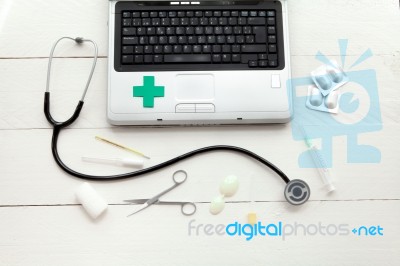 Laptop Computer And Retro Medical Instruments Stock Photo