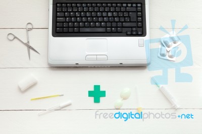 Laptop Computer And Retro Medical Instruments Stock Photo