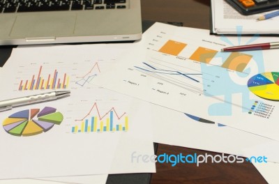 Laptop Documents Graph Stock Photo