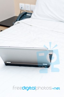 Laptop On Bed Stock Photo