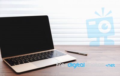 Laptop On Office Table Stock Photo