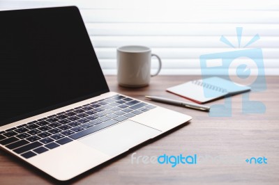 Laptop On Work Desk Stock Photo