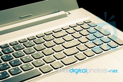 Laptop Or Notebook Button On Black Background Vintage Style Stock Photo