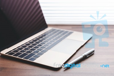 Laptop With Pen Stock Photo