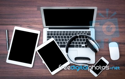 Laptop With Tablet And Smart Phone On Table Stock Photo