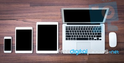 Laptop With Tablet And Smart Phone On Table Stock Photo