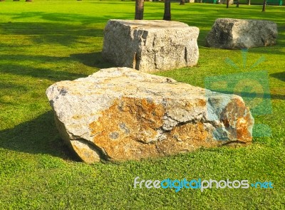 Large Stone On Grass Stock Photo