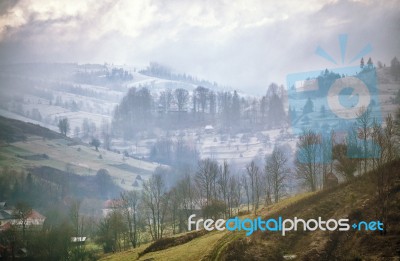 Late Autumn Misty Morning In A Village. First Snow Stock Photo