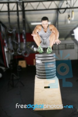 Latin American Athlete Jumping In A Dark Background Stock Photo