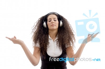 Latin American Female Enjoying Music Stock Photo