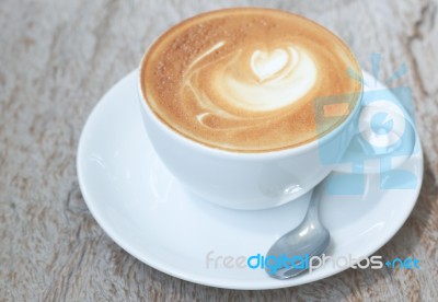 Latte Art  On Wood Background Stock Photo