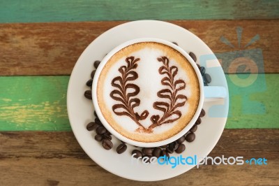 Latte Coffee Art On The Wooden Desk Stock Photo