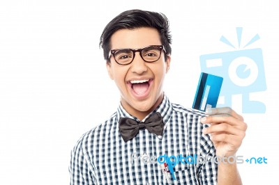 Laughing Guy Holding Credit Card Stock Photo