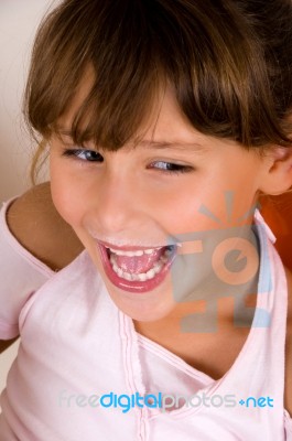 Laughing Little Girl Looking Side Stock Photo