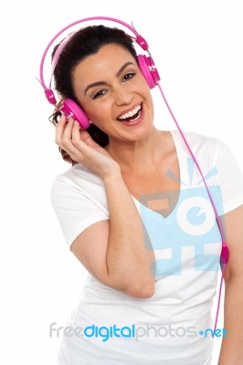 Laughing Woman Enjoying Music Stock Photo