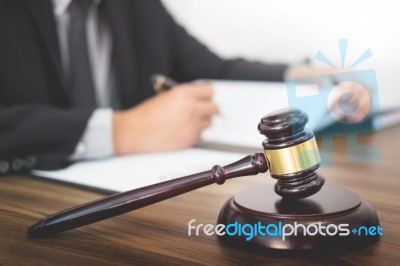 Lawyer Hand Writes The Document In Court (justice, Law) With Sou… Stock Photo