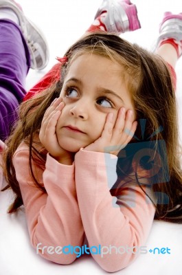 Laying Child Looking Aside Stock Photo