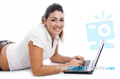 Laying Female Using Laptop Stock Photo